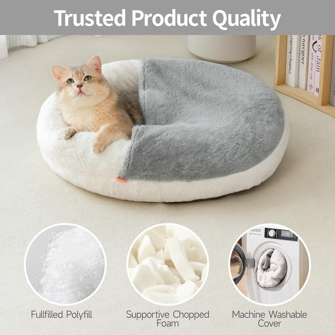Cat lying on a plush pet bed