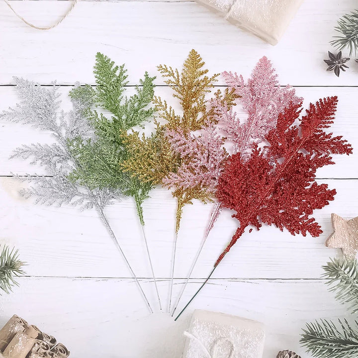 Artificial pine branches with holiday sparkle