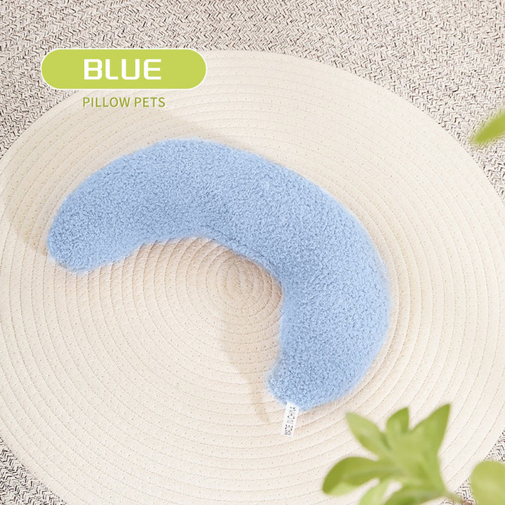 Blue pet pillow on a textured surface