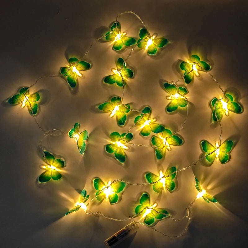 Butterfly string lights illuminating a garden