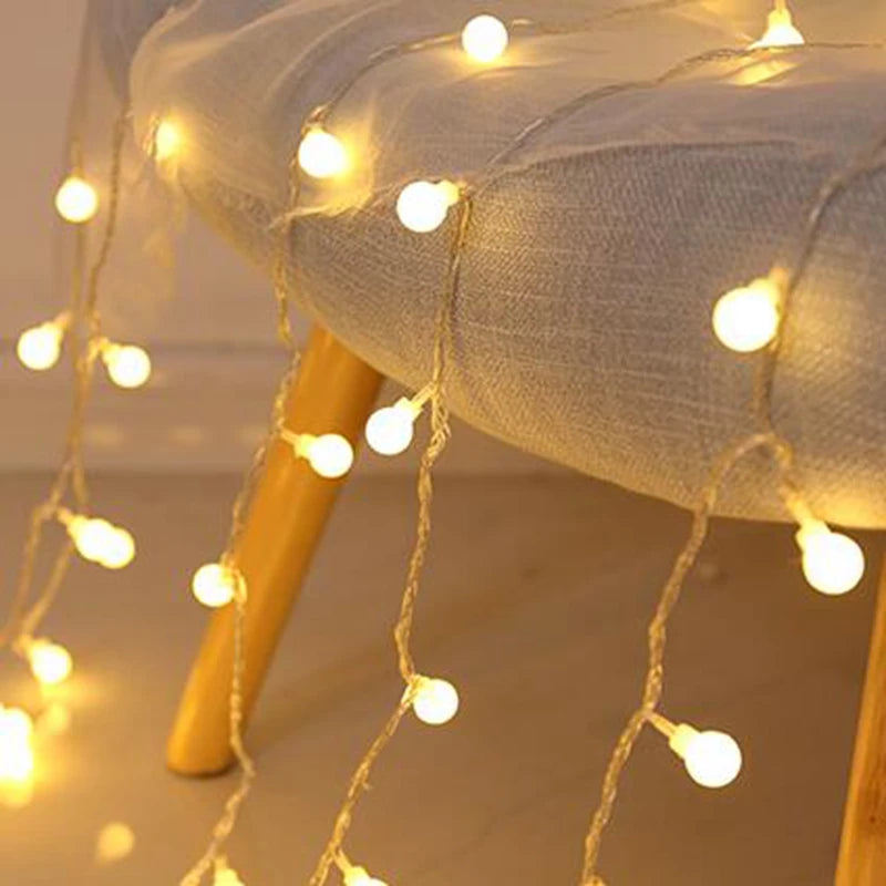 Camping tent illuminated by fairy lights