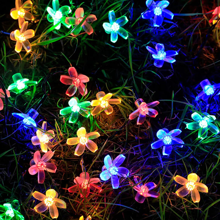 Christmas garland lights with cherry blossoms