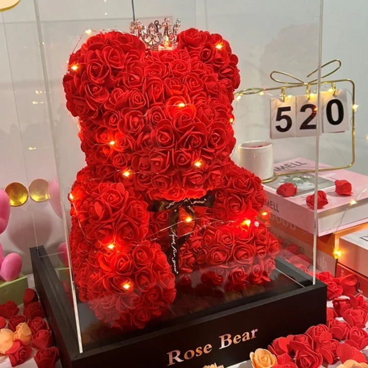 Cute teddy bear with everlasting flowers