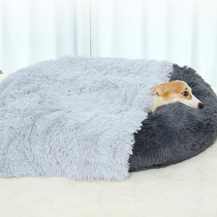 Dog lying on a fluffy gray pet bed