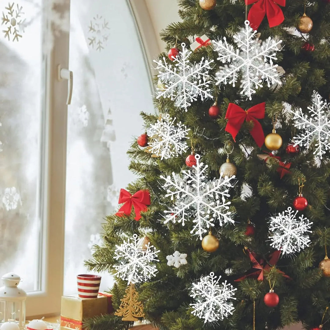 Glittery snowflakes hanging on a Christmas tree