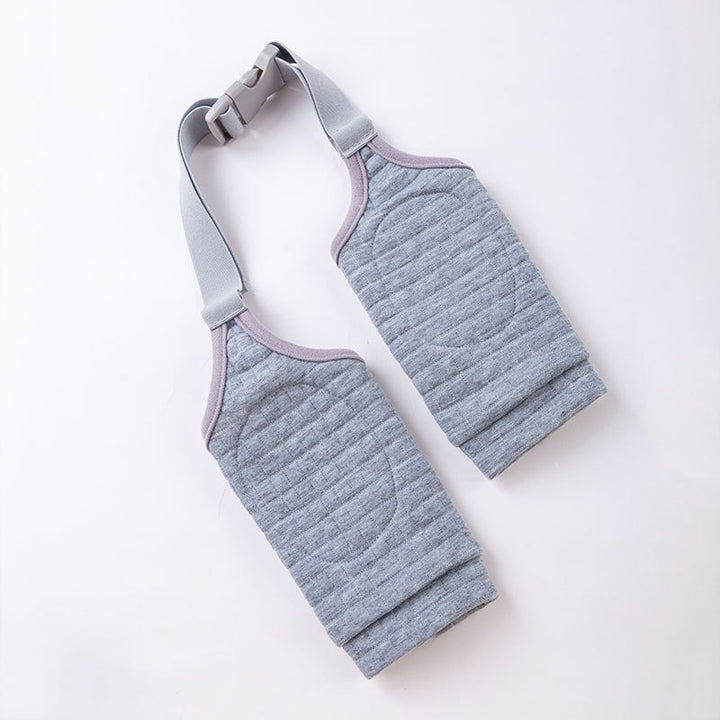 Gray compression garment with straps