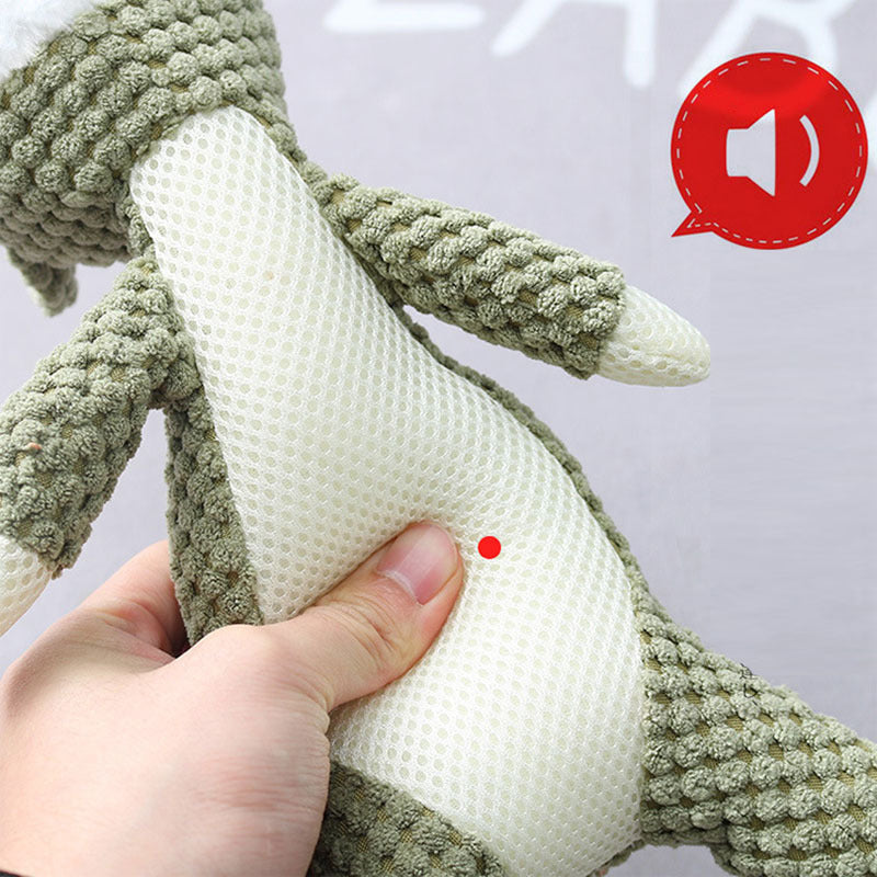 Hand holding a green knitted toy 