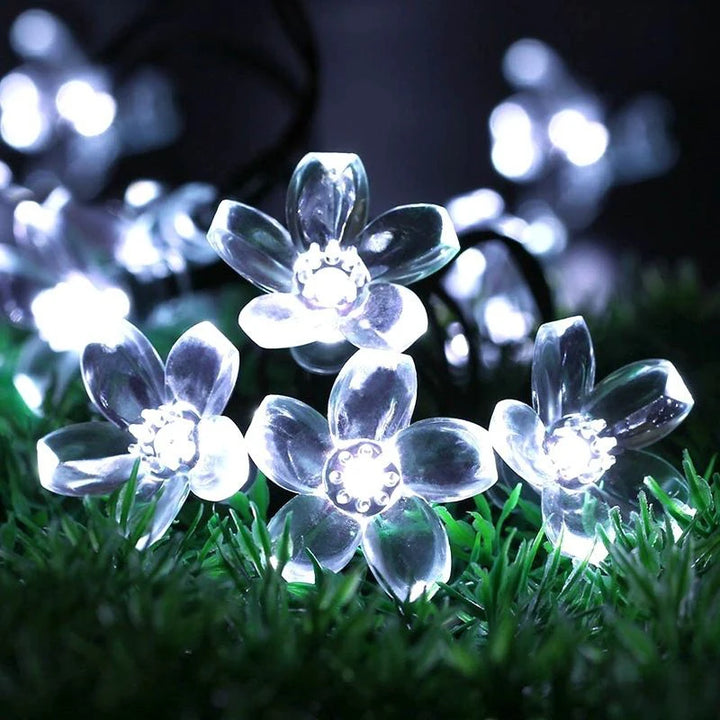 Holiday lighting with LED flower garlands