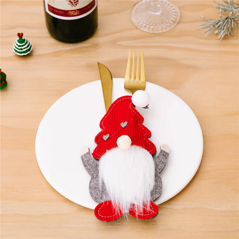 Holiday tableware with Santa Claus knife holders