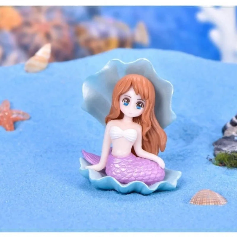 Kawaii mermaid statues for aquarium landscaping.