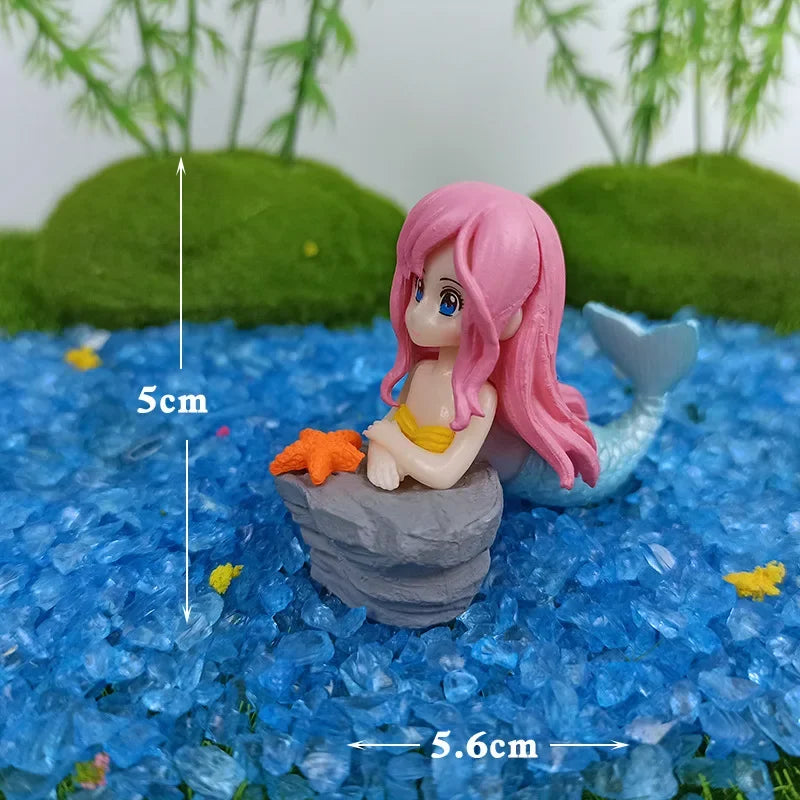 Kawaii mermaid statues for aquarium landscaping.