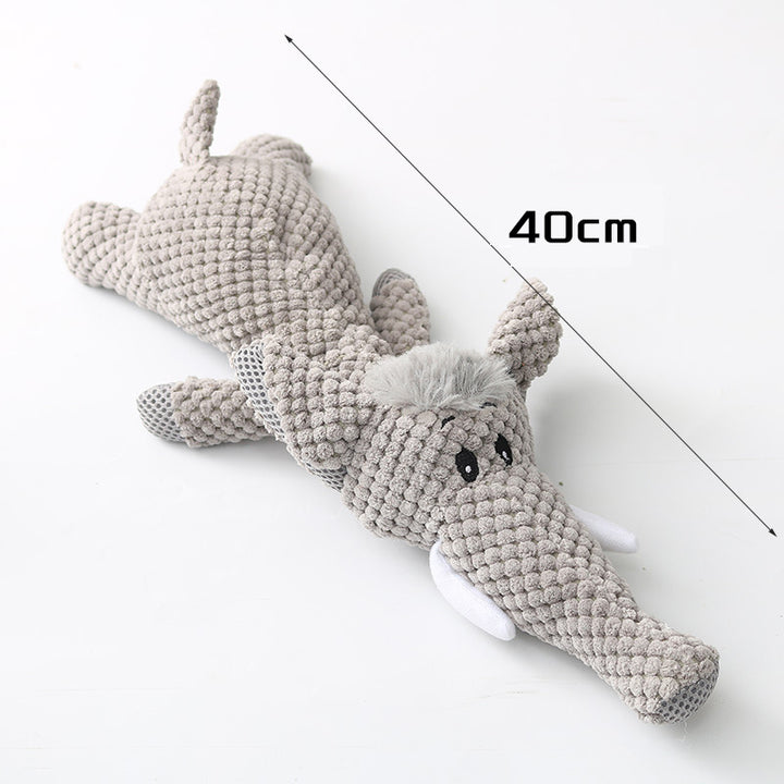 Knitted elephant toy with a measurement label 