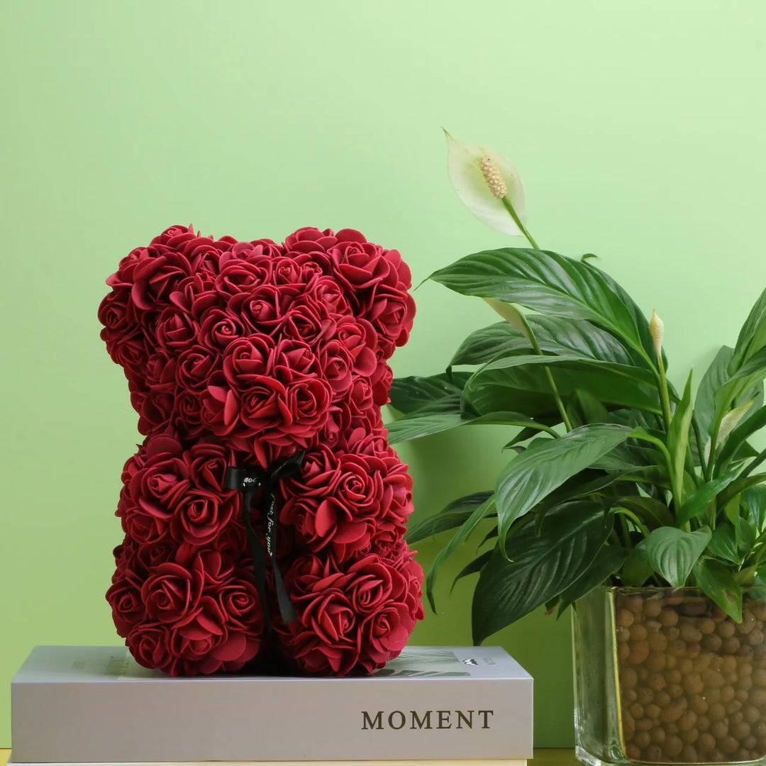 Romantic teddy bear with artificial flowers