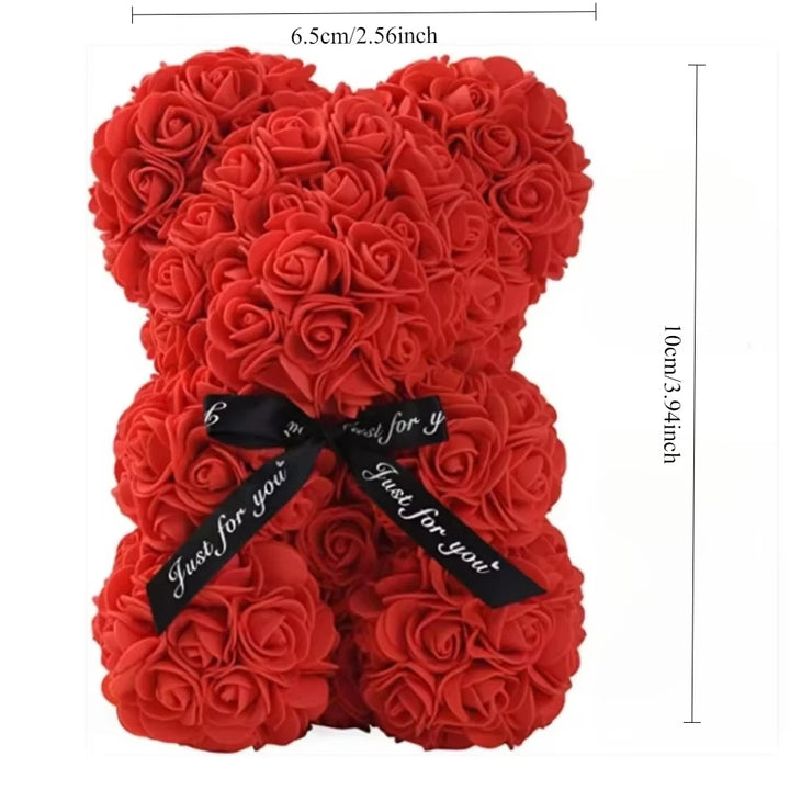 Romantic teddy bear with artificial roses