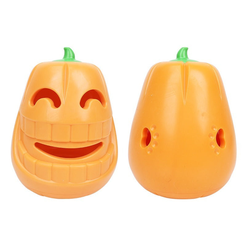Two orange pumpkin shaped noisemakers