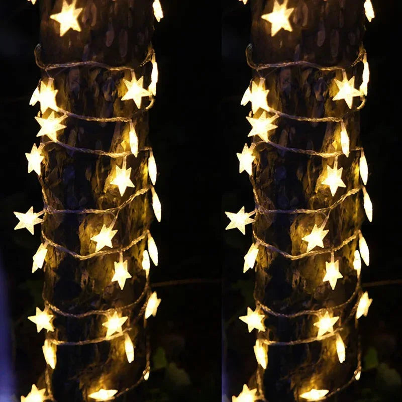 Warm star string lights on bedroom wall