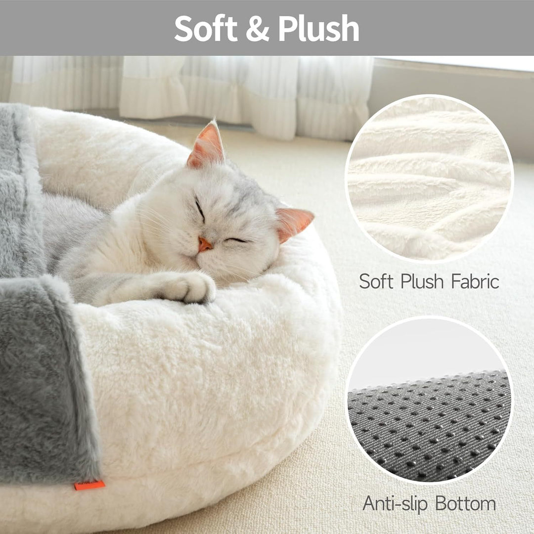 Cat sleeping on a soft plush pet bed 